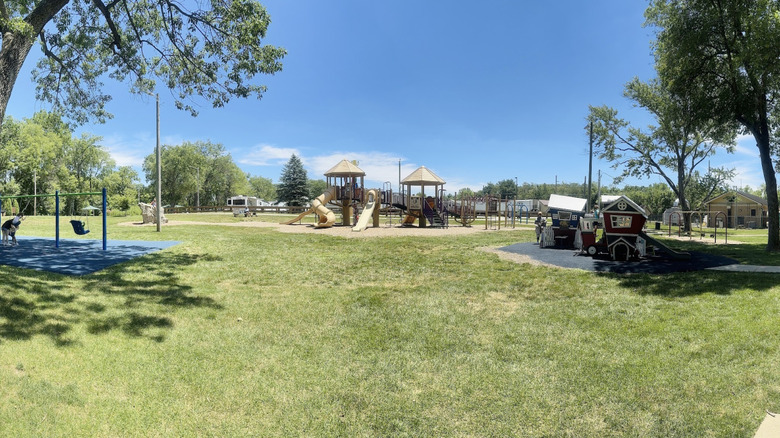 Playground and trees at Arbuckle Acres Park in Brownsburg