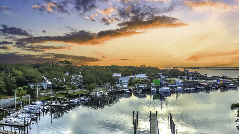 A view of the town of Southport at sunrise surrounded by water and forest in Brunswick County, NC