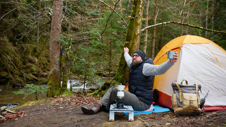 A camper outside enjoying nature