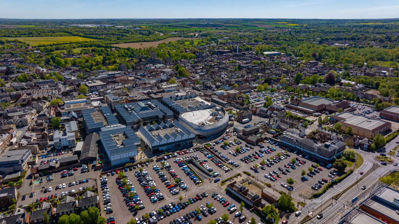 An aerial view of a mall, parking lot, buildings, and trees in Bury St. Edmunds, Suffolk