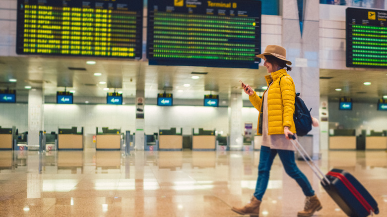 Someone walking through an airport
