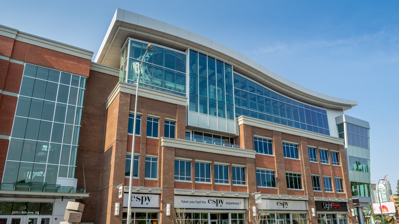 Esker Foundation Gallery, with wavy roof, brick facade, and large glass windows, in Inglewood