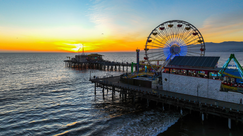 The sun sets over the historic Santa Monica pier