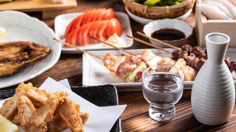 A close-up picture of various Japanese dishes and drinks