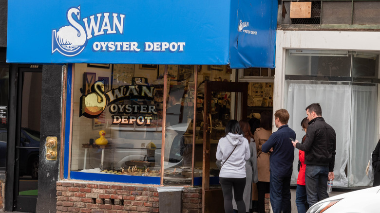 Exterior shot of the Swan Oyster Depot in San Francisco with a line in front of the door