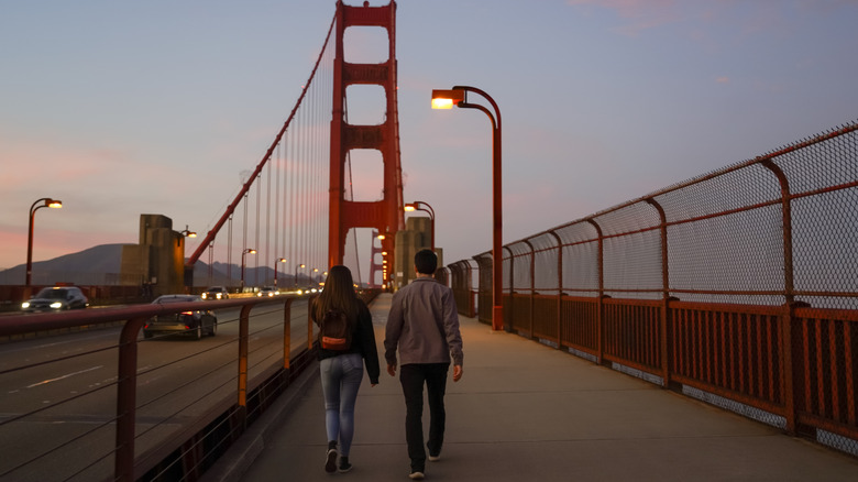 People walking across Golden Gate Bridge in San Francisco, California