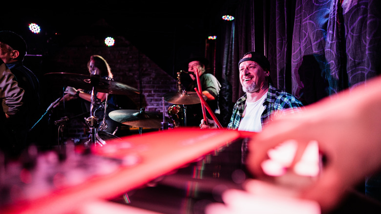 A band plays live music in a lounge setting