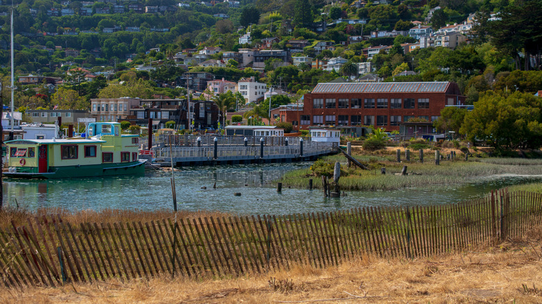 View of Sausalito houseboats on the water and New Town buildings and streets