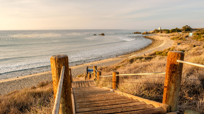 A wooden boardwalk leads to the North Beach at Leo Carrillo State Park and Beach near Malibu, California.
