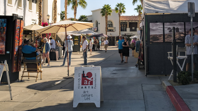 Pedestrians perusing art festival in La Quinta
