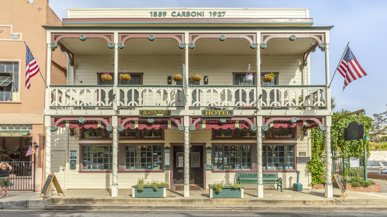 Pink, turquoise, white facade of 1859 Carboni building and National Hotel