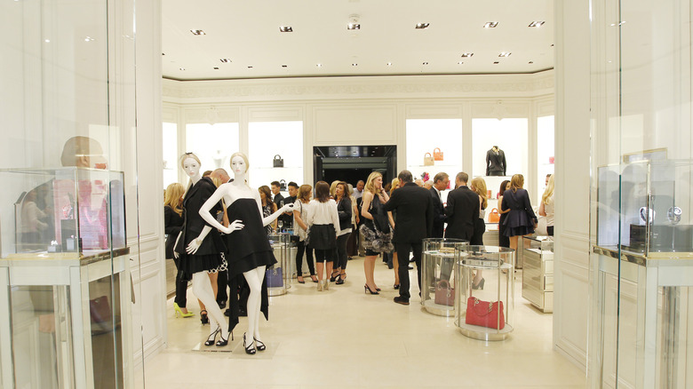 Shoppers peruse the Dior boutique shop at South Coast Plaza