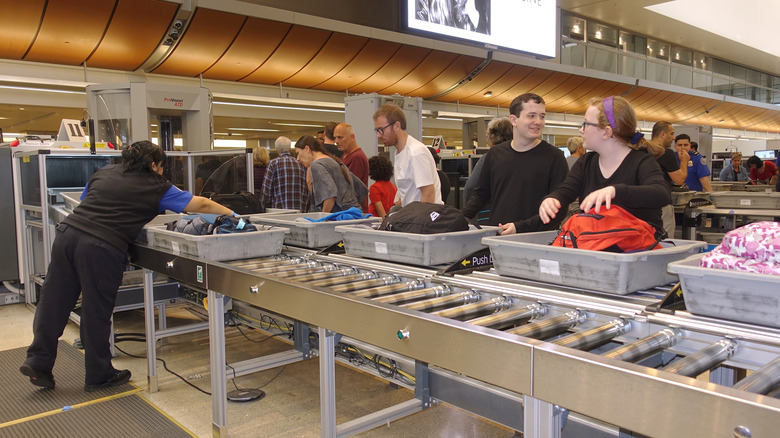 People going through security at LAX