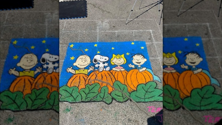A chalk illustration of Charlie Brown and his friends during the Old Town Orcutt Chalk Festival in 2023