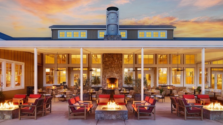 Patio at the Carneros Resort and Spa FARM restaurant with lounge chairs surrounding outdoor fire pits, California