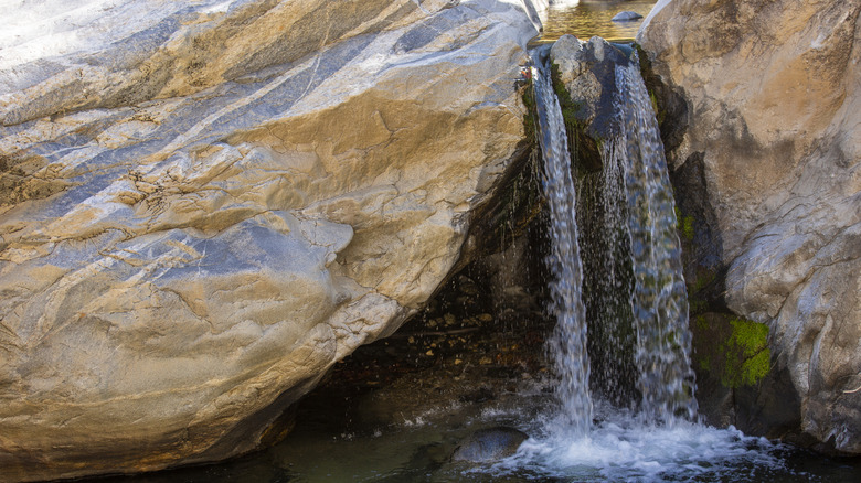 The waterfall in nearby Tahquitz Canyon tumbles through a gap in the rocks