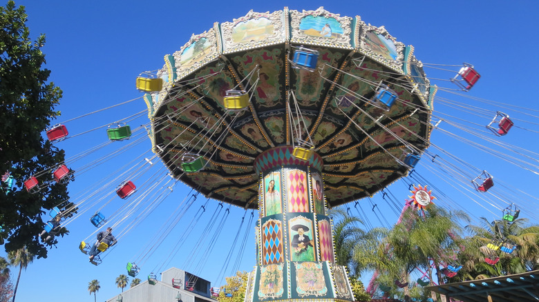 Low-angle view of a swing ride at Knott's Berry Farm, a popular amusement park in Anaheim, California