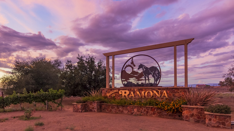 welcome sign to Ramona along with a gorgeous purple sky
