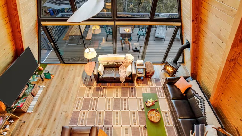 The interior living room view from the second floor with a view of the A-frame windows