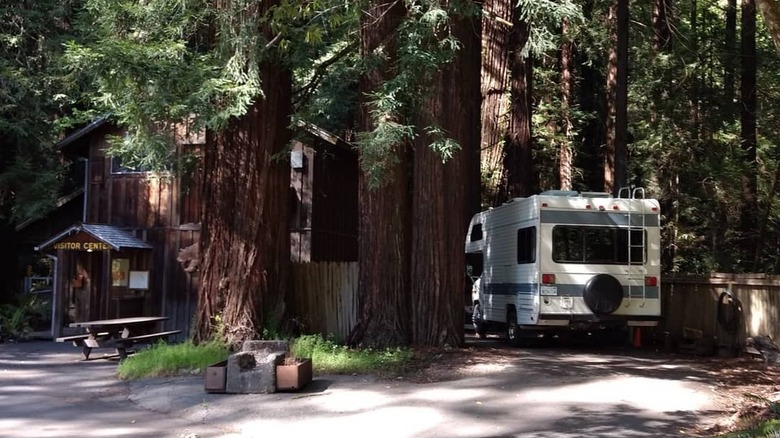 An RV is parked outside the Grizzly Creek Redwoods Visitor Center
