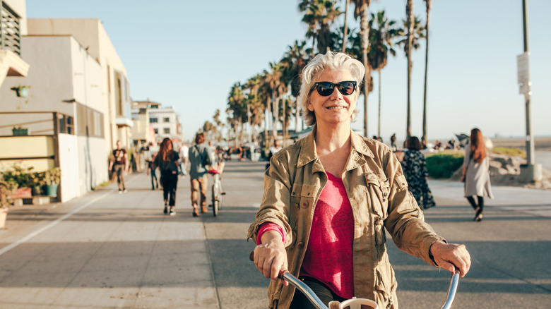 Senior woman riding a bike in California