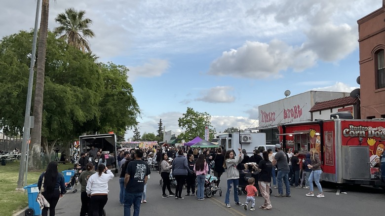 People attend a food truck rally