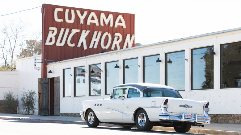 Exterior shot of Cuyama Buckhorn hotel with a vintage car