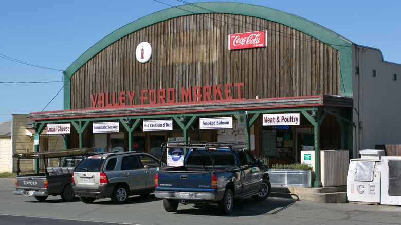 Cars are parked outside the Valley Ford Market
