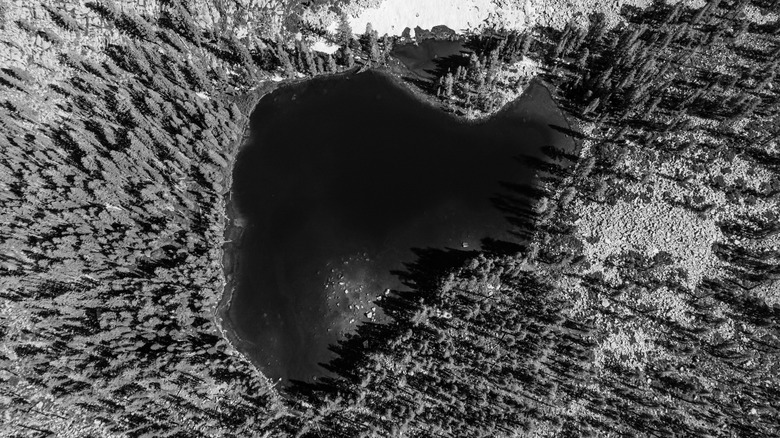 Black and white view of Weaver Lake surrounded by rocky and forested California landscapes