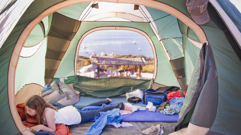 Girl inside tent at Two Harbors on Catalina Island