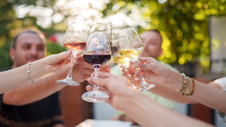people toasting glasses of wine