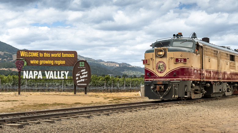 Napa Valley Wine Train riding past the Napa Valley welcome sign