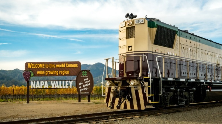Napa Valley Wine Train riding past the Napa Valley welcome sign