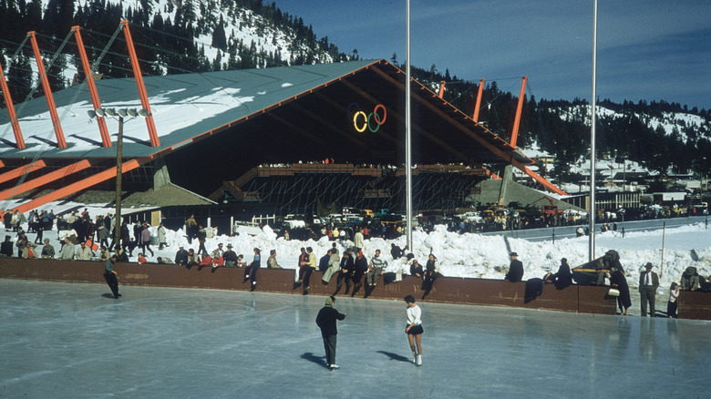 Figure skaters practice and skate on an ice rink at the 1960 Winter Olympics