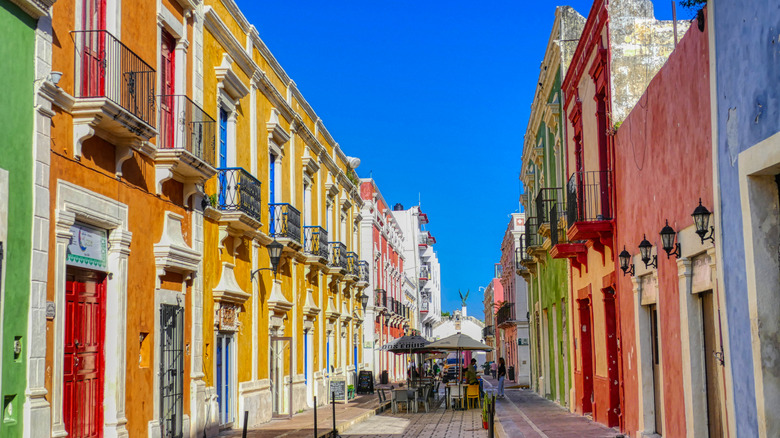 Colorful colonial buildings and cobblestone streets lined with cafes in Campeche, Mexico
