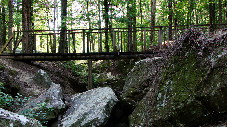 A trail bridge over a rocky area