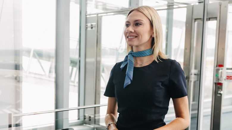 Smiling gate agent at an airport