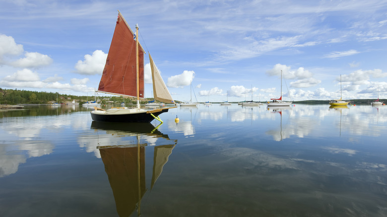 Sailboats reflects on Yellowknife Bay, Great Slave Lake