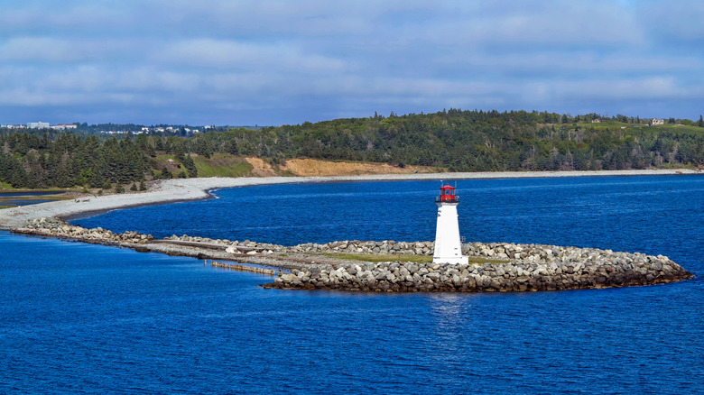 The lighthouse and shoreline on McNabs Island in Halifax, Nova Scotia
