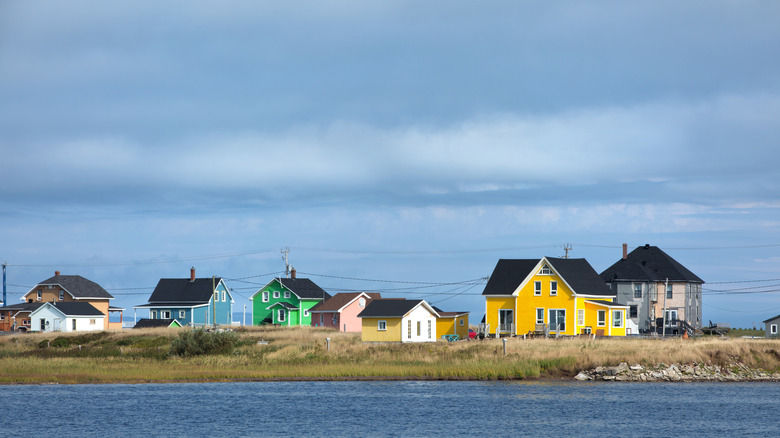 Colorful houses along the shore of Havre-Aubert Island