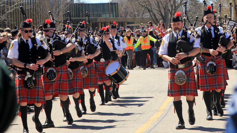 Bagpipers and drummer march during Swan Festival, Stratford, Ontario