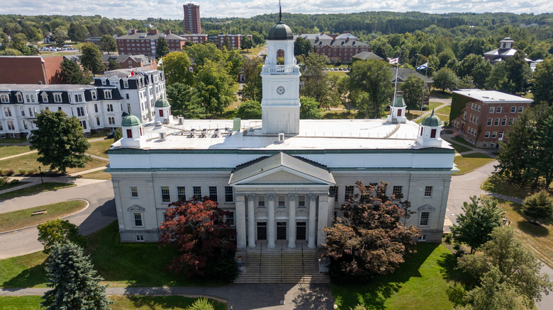 Greek style columnade building surrounded by fall foliage