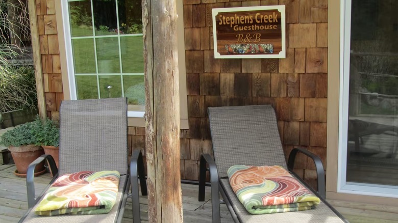 Relaxing chairs on a wooden terrace at Stephens Creek Guesthouse
