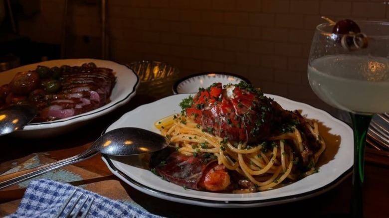 Lobster spaghetti and steak at Joe Beef in Saint-Henri, Montreal.