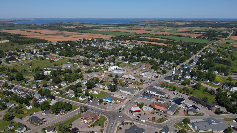 Aerial view of Kensington on Prince Edward Island with houses, streets, farmland and coastline