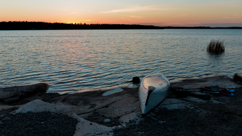 A canoe pulled up on a lakeshore in Nopiming Provincial Park, Manitoba