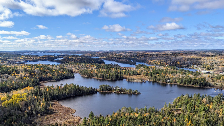 Aerial shot of a lake with numerous tree covered islands