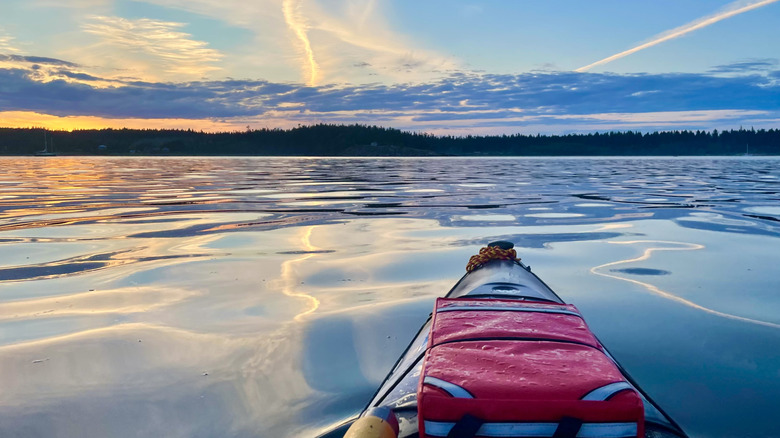 A shot of a kayak on the glassy waters of a lake in Canada