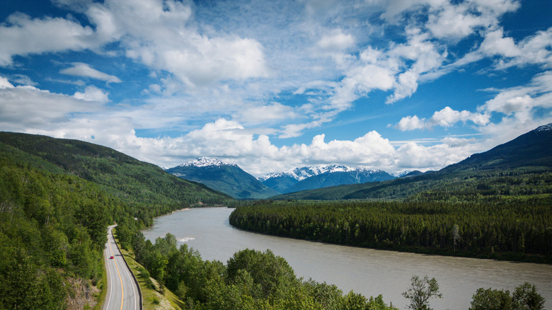 The Skeena River between snow-capped mountains near Terrace, British Columbia