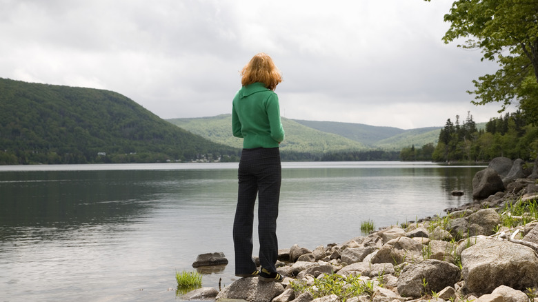 Woman overlooking Bras d'Or Lake near Whycocomagh